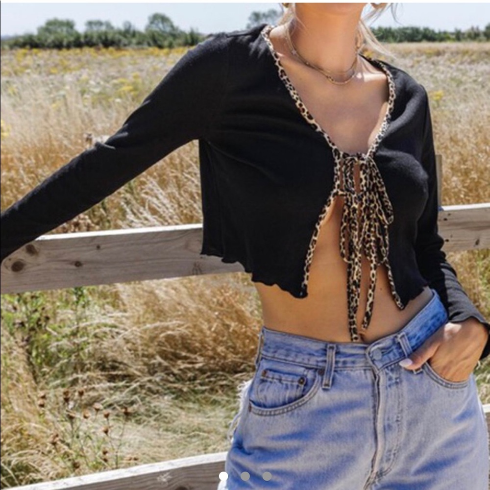 cheetah trim black open tie top in size small